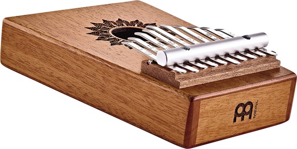 A wooden box with a Meinl 10 notes Kalimba, Mahogany for sound healing therapy inside.