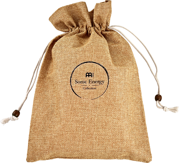 A serene Meinl drawstring bag with a tassel on it, perfect for yoga or meditation sessions, holding the 10 notes Kalimba in Mahogany.