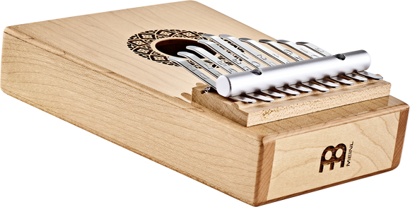 A wooden box housing a Meinl Sonic Energy Soundhole Kalimba, also known as a thumb piano, for sound healing therapy.