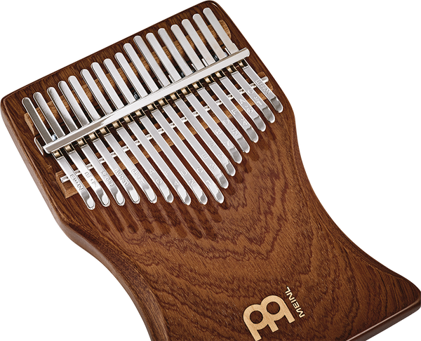 A Meinl 17 notes Kalimba, Sapele, a melodic instrument, on a white background.