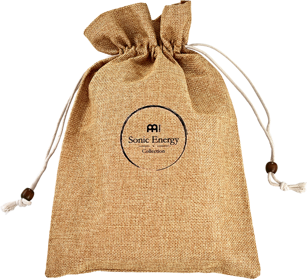 A tan drawstring bag featuring a tassel and designed to store the Meinl Sonic Energy Sapele Kalimba, a melodic instrument.