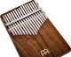 A melodic instrument made of Meinl 17 notes Kalimba, Acacia wood, resembling a wooden xylophone, placed on a white background.