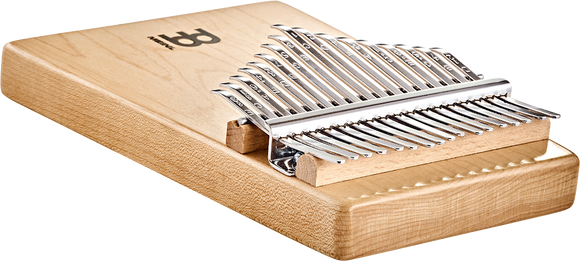 A wooden box with a 17 notes Kalimba Maple, also known as a melodic instrument, on top from Meinl brand.