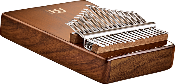 A Meinl Sonic Energy Wah-Wah Kalimba, 17 notes, Acacia, a wooden musical instrument producing enchanting sound, housed within a box.
