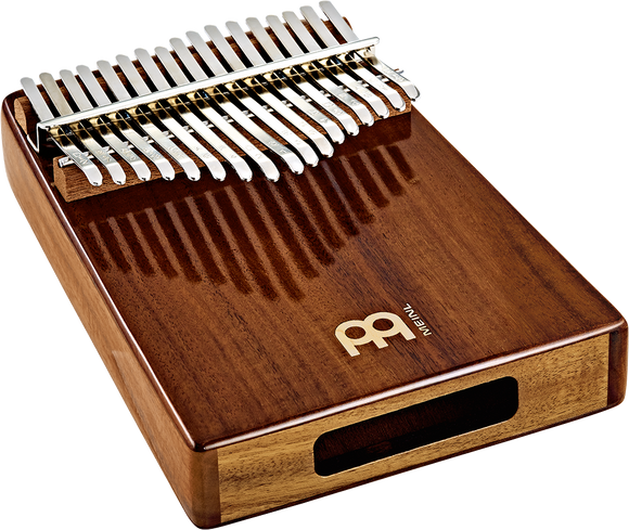 An instrument made of wood, combining the sound of a ukulele with a set of keys reminiscent of a Meinl Sonic Energy Wah-Wah Kalimba, 17 notes, Acacia.