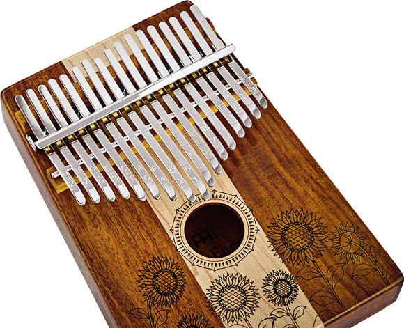 The Meinl 17 notes Kalimba, Maple & Acacia is a melodic instrument made of wood and adorned with beautiful sunflowers. Its delicate craftsmanship and the inclusion of the C Major scale make for a captivating musical experience.