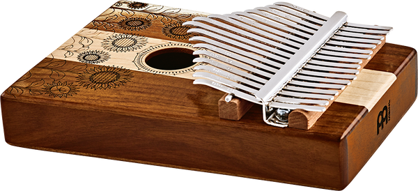A melodic instrument housed in a wooden box, the Meinl Sound Hole Kalimba (17 notes Kalimba, Maple & Acacia) produces beautiful sounds from its C Major scale.