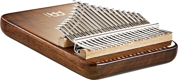 A melodic instrument, the 21 notes Kalimba from Meinl, is elegantly housed inside a wooden box crafted from black walnut wood.