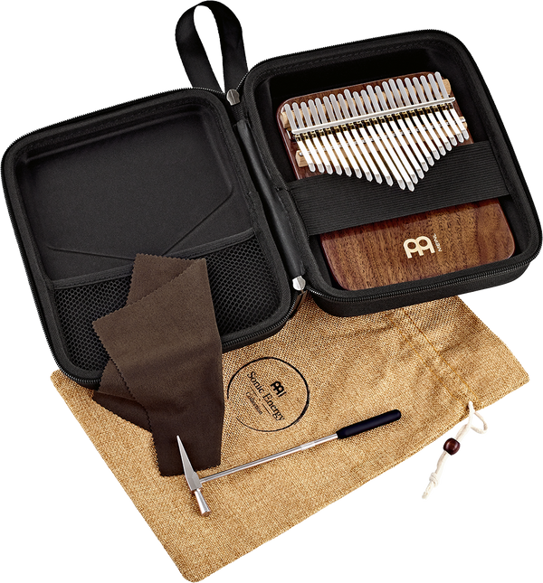 A bag with a Meinl 21 notes Kalimba, Black Walnut made of black walnut wood in it.