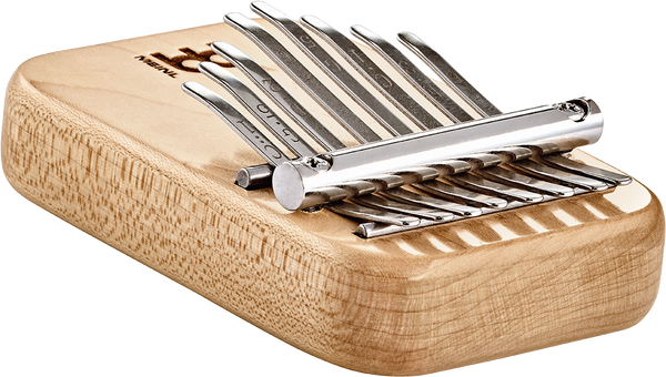 A Meinl 8 notes Kalimba, Maple wood box with a set of pliers on it.