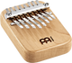 A Meinl 8 notes Kalimba, Maple, also known as a melodic instrument, on top of a white background.