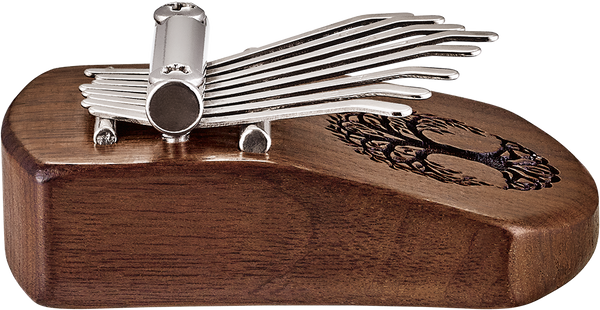 A wooden box with a set of tools, perfect for musicians seeking sound healing therapy with a Meinl 8 notes Kalimba, Tree Of Life, Black Walnut.