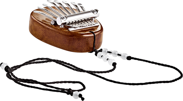 A Meinl 8 notes Kalimba made of sapele wood, a melodic instrument with a string attached to it.