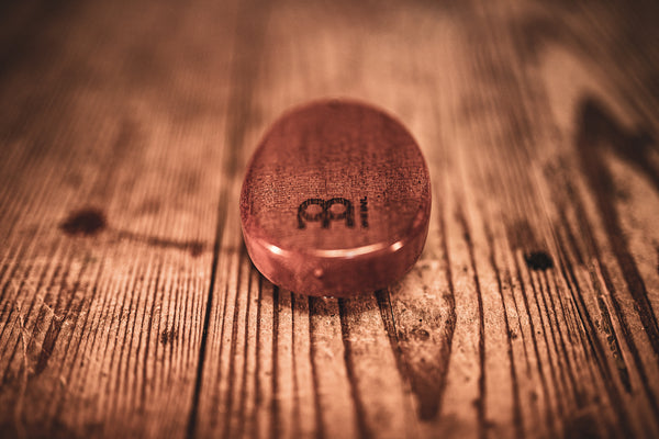 A Meinl 8 notes Kalimba, made from sapele wood with the word ip on it.