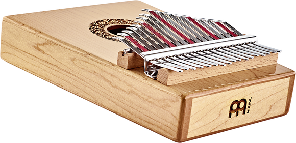 A Meinl 17 notes Kalimba, Maple with a soft-sounding melodic instrument, the hammered dulcimer, producing ethereal tones.