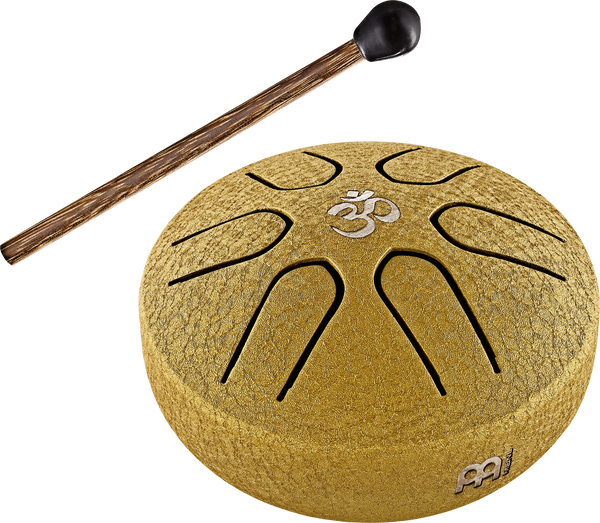 A Meinl 3" Tongue Drum, A Major, OM, Gold, played with a wooden stick by a sound therapist.